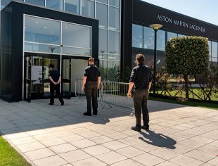 Aston Martin employees line up outside