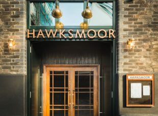 Exterior of Hawksmoor, Borough, featuring the double-doors and menu